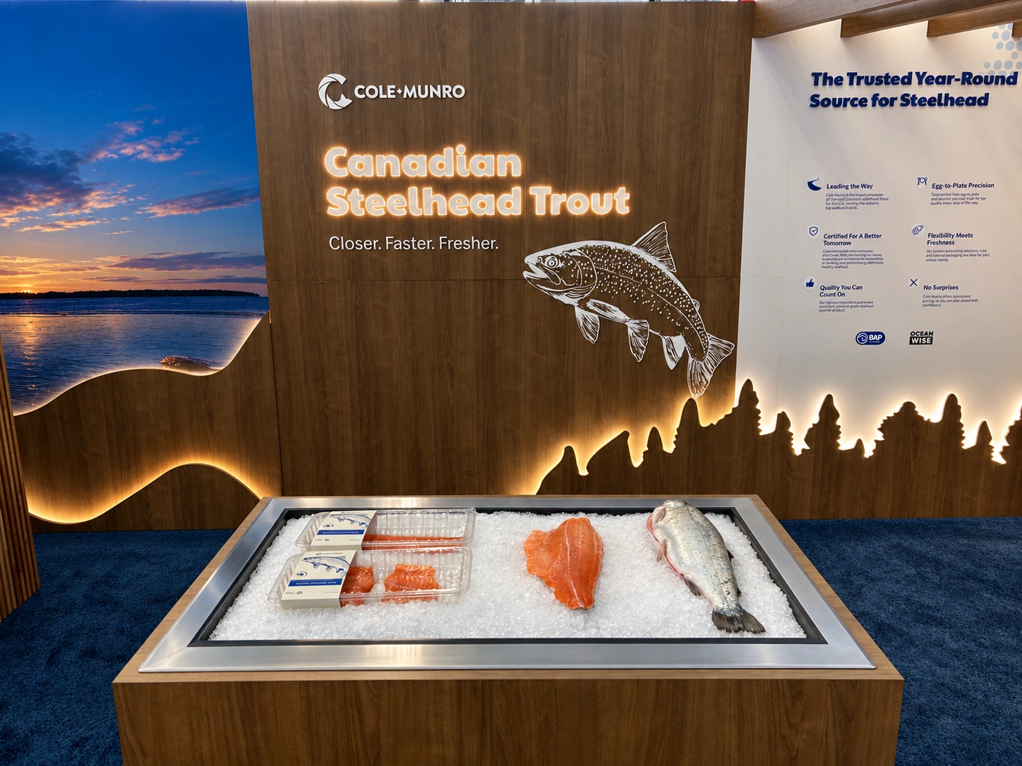 Steelhead trout display in front of illuminated signage, wood grain and a glowing forest silhouette.