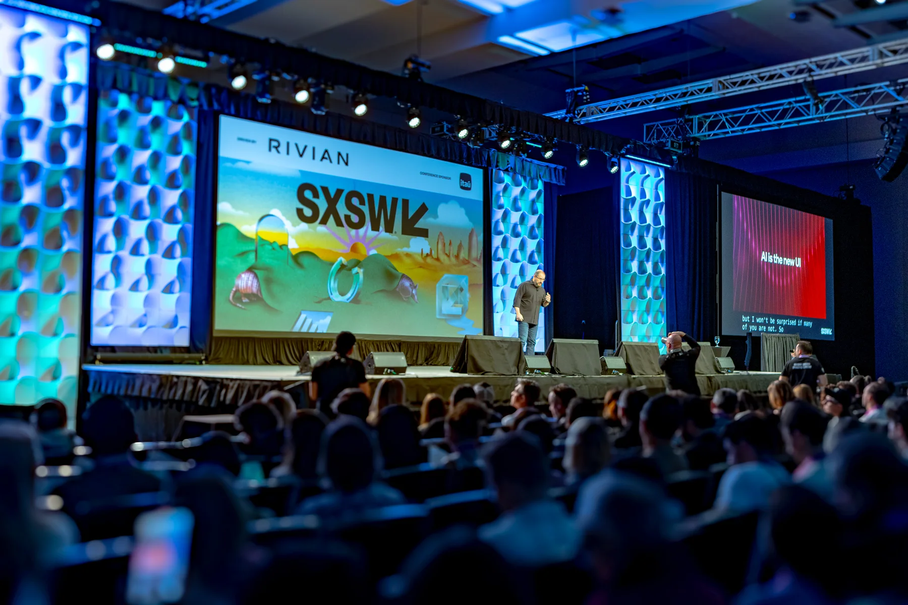 The Qualcomm SXSW keynote stage and a full audience under blue lighting.