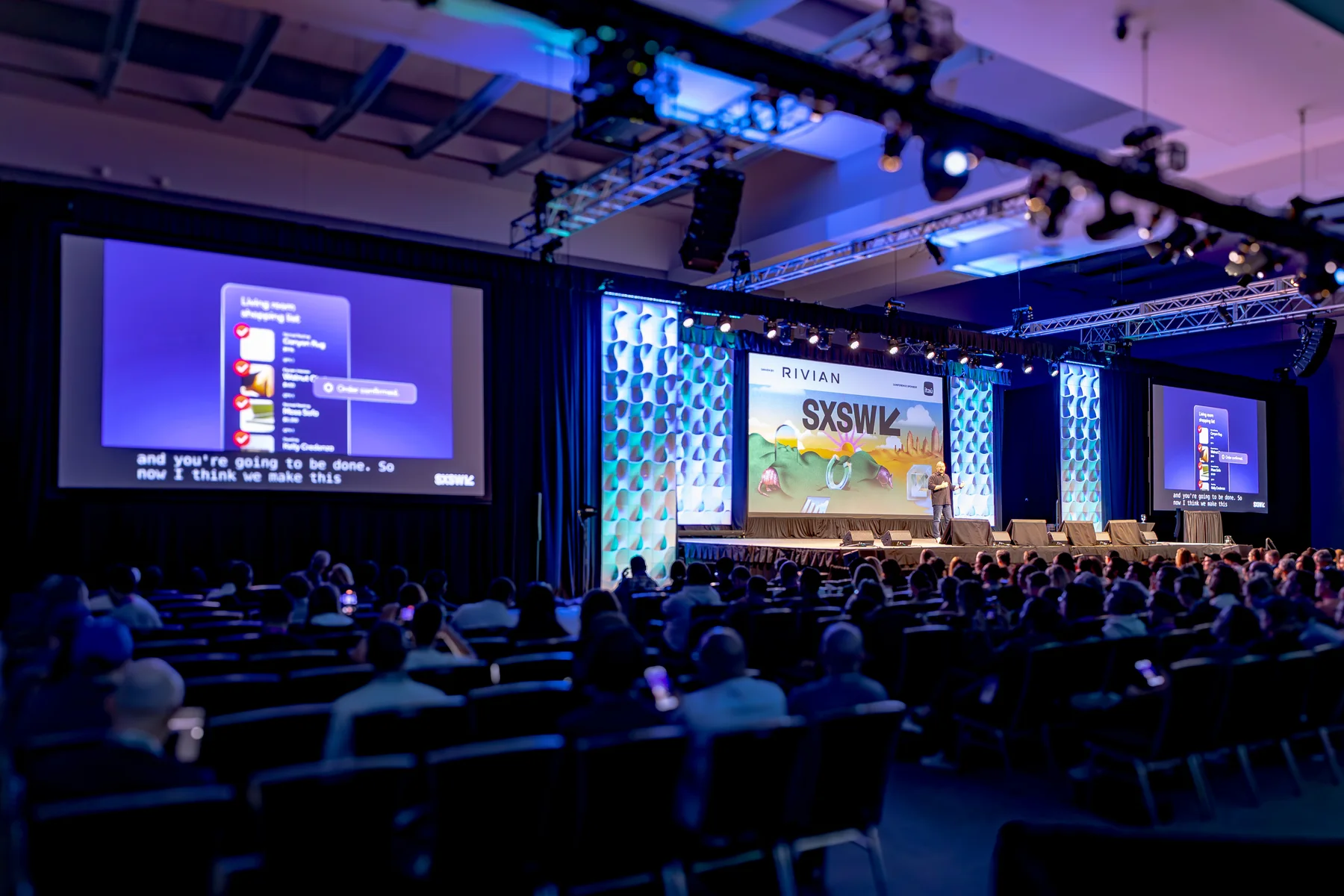 Mobile interface visuals appear on large screens on either side of the SXSW stage.