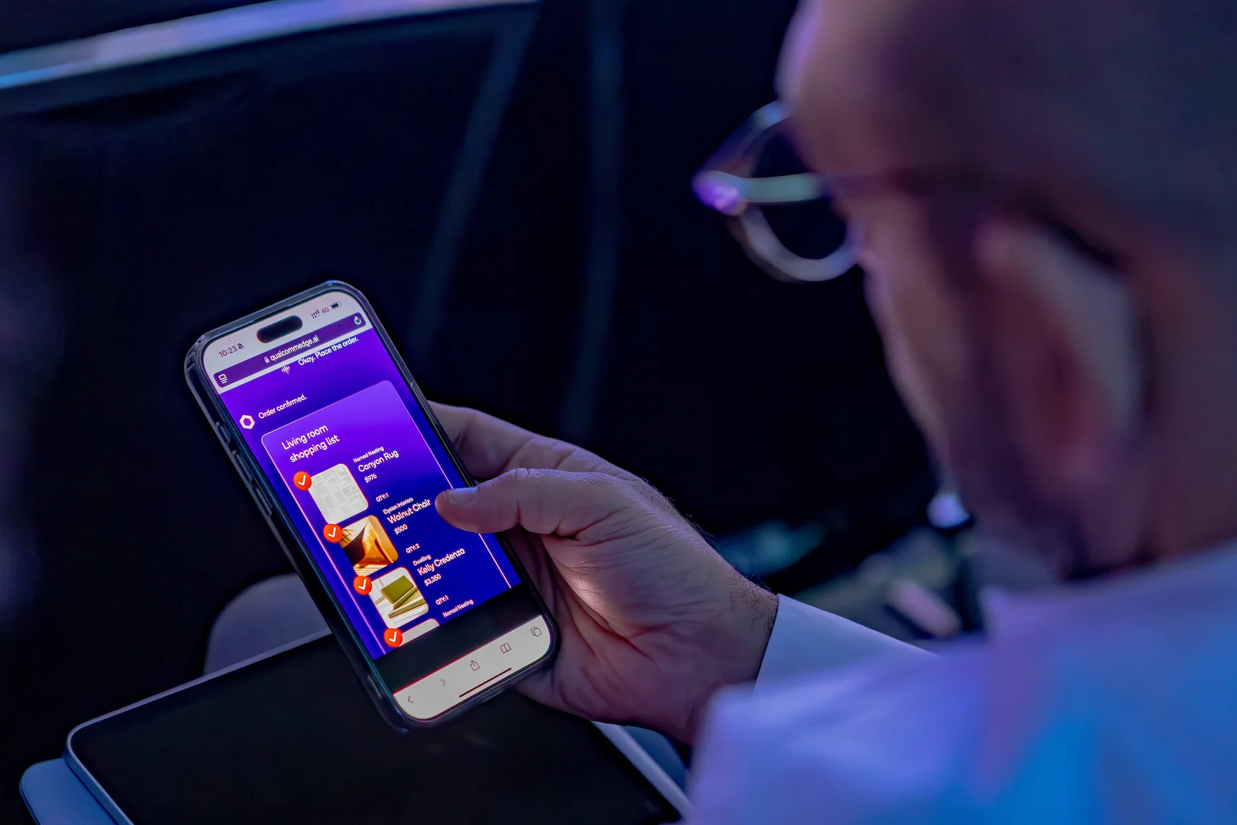 A close view of the purple mobile interface during the keynote.